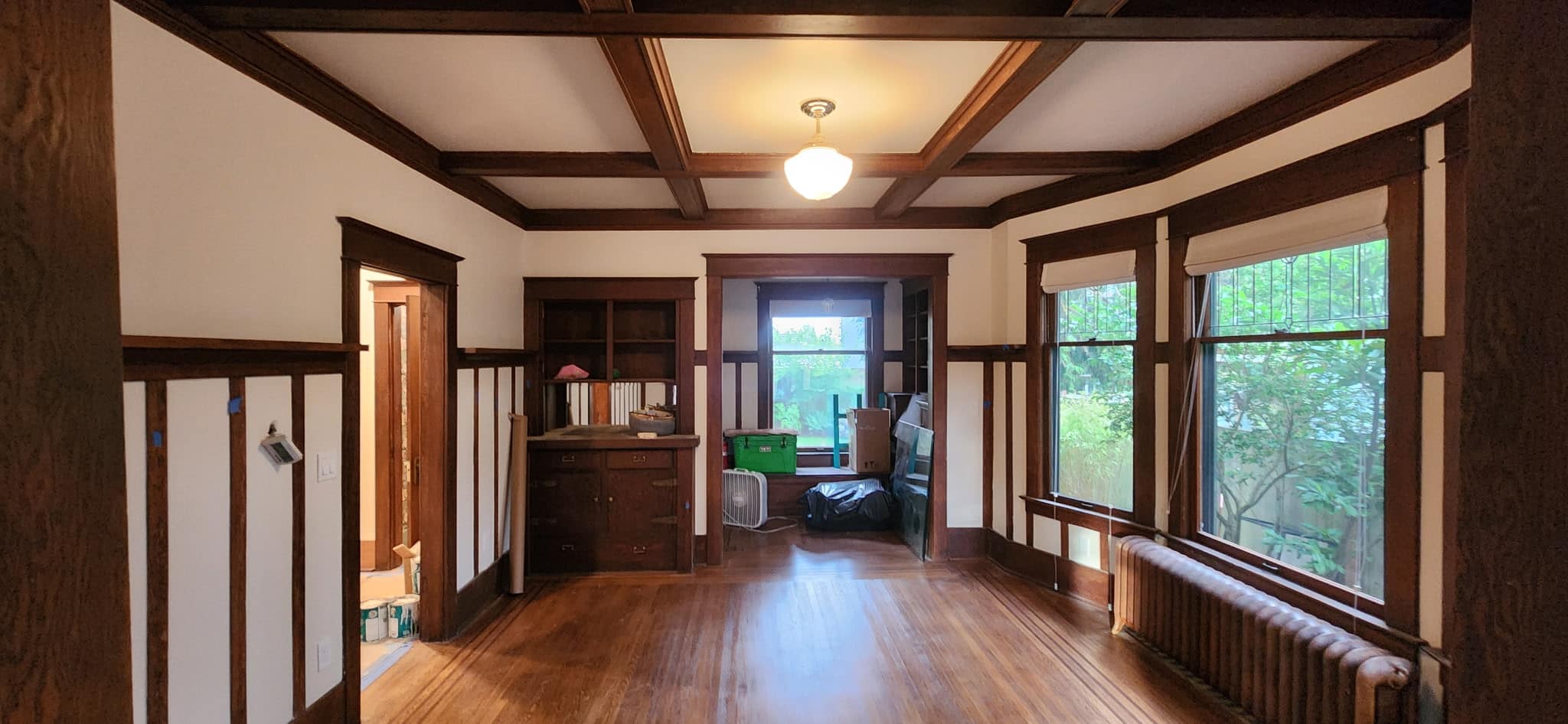 Craftsman Interior Painting with Stained Trim and a Restored 1909 Door in Ballard, Seattle